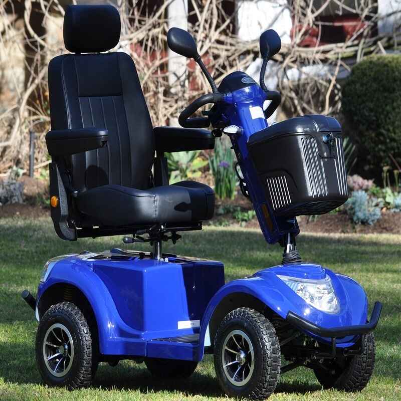 Freedom Gladiator Mobility Scooter in Blue in a grassy field