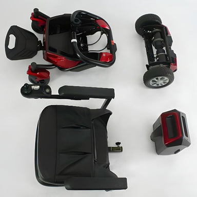 Top down view of the Freedom Lunar Powerchair in red, dismantled into 4 pieces.