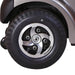 Close up view of the wheels of a Trek Bravo Mobility Scooter in Grey.